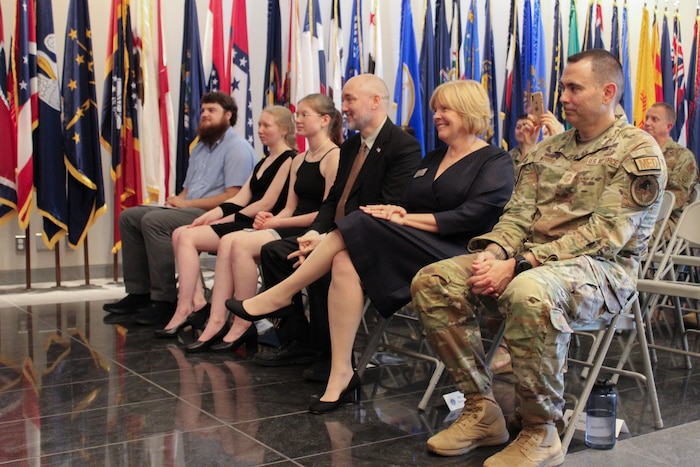 Image of people sitting in chairs.