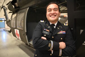 Chief Warrant Officer 2 Christopher Alora, operations officer and UH-60 Black Hawk pilot, District of Columbia Army National Guard, stands for a photograph at Davison Army Airfield, Va., April 16, 2024.