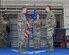 U.S. Air Force Col. Bruce Guest, 509th Maintenance Group commander, left, and Maj. Sean Christy, former 509th Aircraft Maintenance Squadron commander and now 393rd Bomber Generation Squadron commander, perform deactivation of the 509th AMXS and activation of the 393rd BGS at Whiteman Air Force Base, Mo., May 17, 2024. The change from the 509th AMXS to the 393rd Bomber Generation Squadron helps align the maintenance unit with its operations counterparts. (U.S. Air Force photo by Senior Airman Bryson Britt)