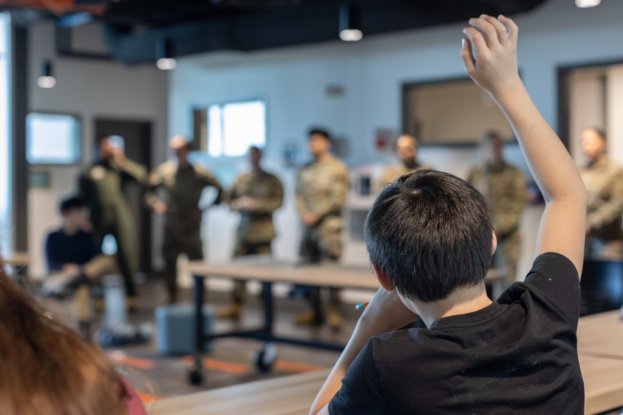 Airmen from Air Mobility Command and Joint Base McGuire-Dix-Lakehurst speak with Alaska high school students in Anchorage, Alaska May 14, 2024. Teams from AMC and JBMDL traveled to Alaska with the Indigenous Nations Equality Team to remove barriers and improve outreach, recruitment and retention. (U.S. Air Force photo by Chris Bishop)