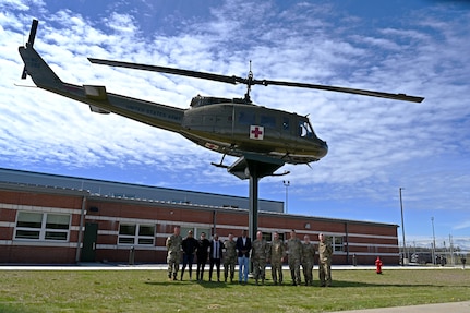 New Hampshire Guardsmen and military aviators from Cabo Verde, including Col. Domingos Correia (middle), the West African nation’s director of national defense, convene at the Army Aviation Support Facility on May 10, 2024, in Concord, N.H.