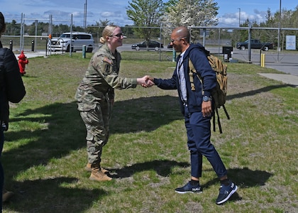 Spc. Olivia Palmiter bids farewell to Maj. Antonio Valerio, a pilot with the Cabo Verdean Armed Forces, on May 10, 2024, at the Army Aviation Support Facility in Concord, New Hampshire.