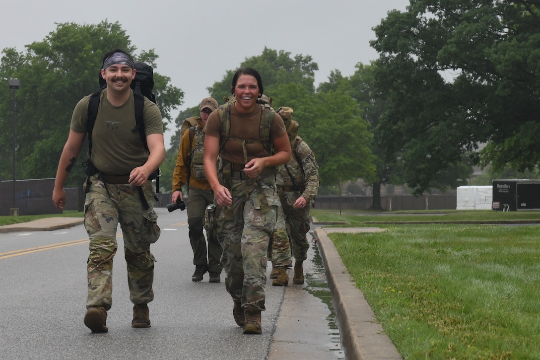 Service members ruck marching