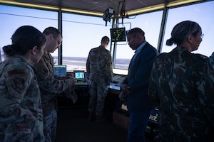 Leadership explains air traffic control procedures in the tower