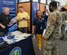 Team McChord Airmen attend the McChord Field Brown Bag Hiring Fair at the customer service mall, Joint Base Lewis-McChord, Washington, May 14, 2024. All Department of Defense I.D. card holders are welcome to this hiring event including spouses of family members.  (U.S. Air Force photo by Senior Airman Colleen Anthony)