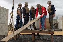 Members of Vistage conduct the leadership reaction course at Marine Corps Base Camp Pendleton, California, May 15, 2024. Vistage members observed recruit training in order to gain a better understanding about the transformation from recruits to United States Marines. They also received classes and briefs about benefits provided to service members serving in the United States armed forces. (U.S. Marine Corps photo by Lance Cpl. Jacob B. Hutchinson)