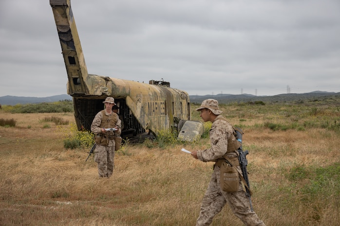 U.S. Marine Corps Recruits Ezra Miller, left, and Anthony Pereyra, right, with Lima Company, 3rd Recruit Training Battalion, participate in a land navigation training exercise at Marine Corps Base Camp Pendleton, California, May 16, 2024. Land navigation is part of basic warrior training and is designed to teach recruits how to use a compass and map for navigation. (U.S. Marine Corps photo by Lance Cpl. Janell B. Alvarez)