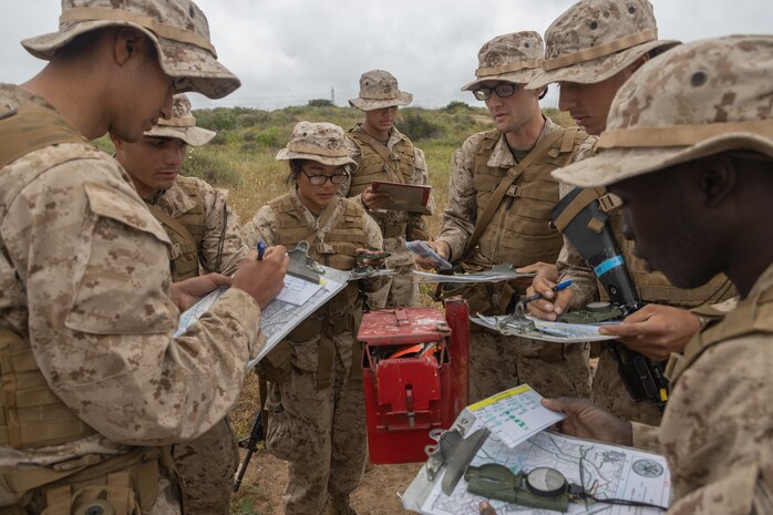 U.S. Marine Corps recruits with Lima Company, 3rd Recruit Training Battalion, locate a map point during the land navigation training exercise at Marine Corps Base Camp Pendleton, California, May 16, 2024. Land navigation is part of basic warrior training and is designed to teach recruits how to use a compass and map for navigation. (U.S. Marine Corps photo by Lance Cpl. Janell B. Alvarez)