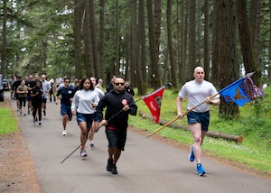 Airmen and civilians with the 62d Aerial Port Squadron participate in the Port Dawg Memorial Run at Joint Base Lewis-McChord, Washington, May 16, 2024. Air transportation Airmen and staff, commonly referred to as Port Dawgs, held the 11th annual event to honor and remember all Aerial Port Airmen who have died in the line of duty.