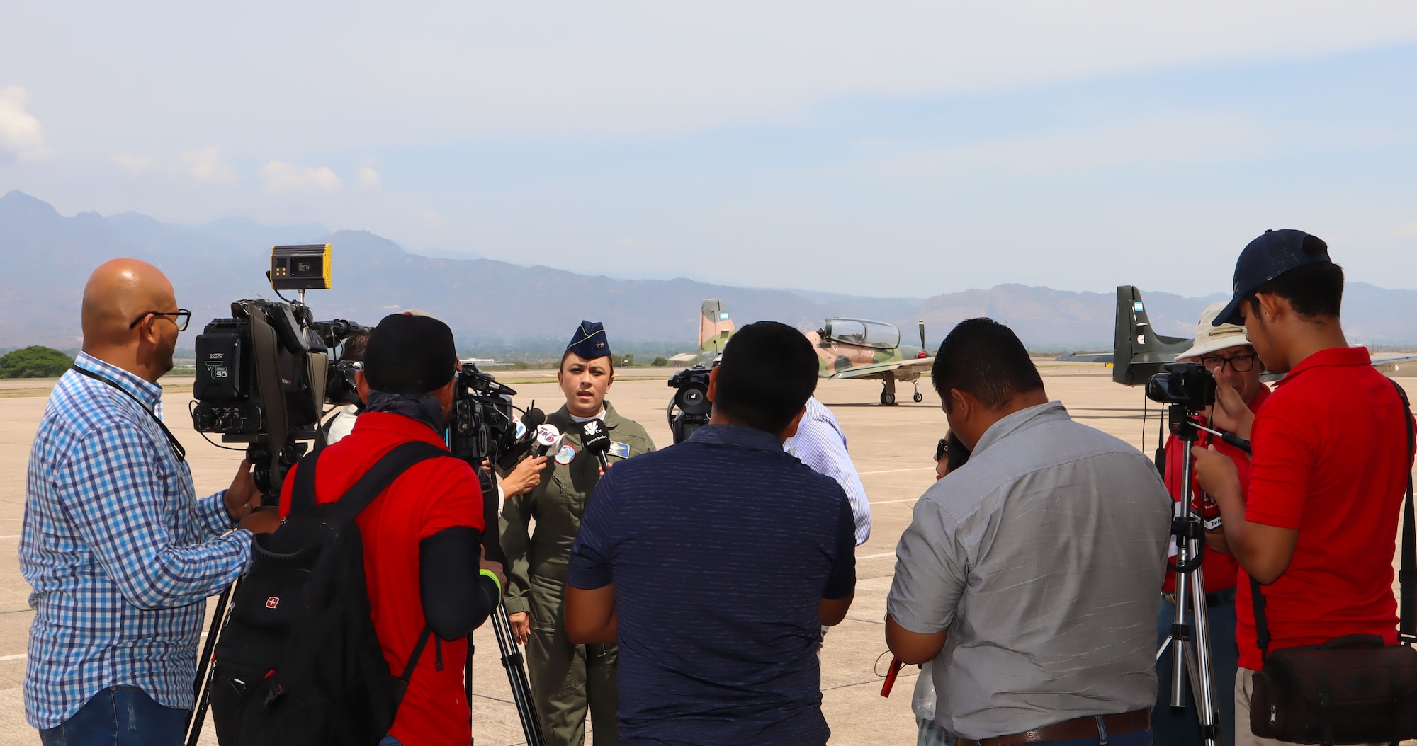 A photo of a military member being interviewed.