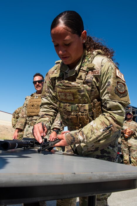 Airman disassembles a rifle during a Warrior Challenge