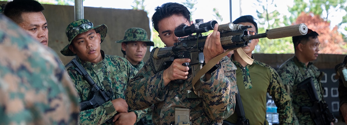 240515-M-OV505-2311 COTABATO, Philippines (May 15, 2024) U.S. Marine Corps Lance Cpl. Zachary Becker, a team leader with 1st Battalion, 7th Marine Regiment, 1st Marine Division, shares tactics at a weapon systems training and safety brief during Archipelagic Coastal Defense Continuum near Cotabato City, Philippines, May 15, 2024. ACDC is a series of bilateral exchanges and training opportunities between U.S. Marines and Philippine Marines aimed at bolstering the Philippine Marine Corps’ Coastal Defense strategy while supporting the modernization efforts of the Armed Forces of the Philippines. Becker is a native of California. (U.S. Marine Corps photo by Cpl. Kayla Halloran)