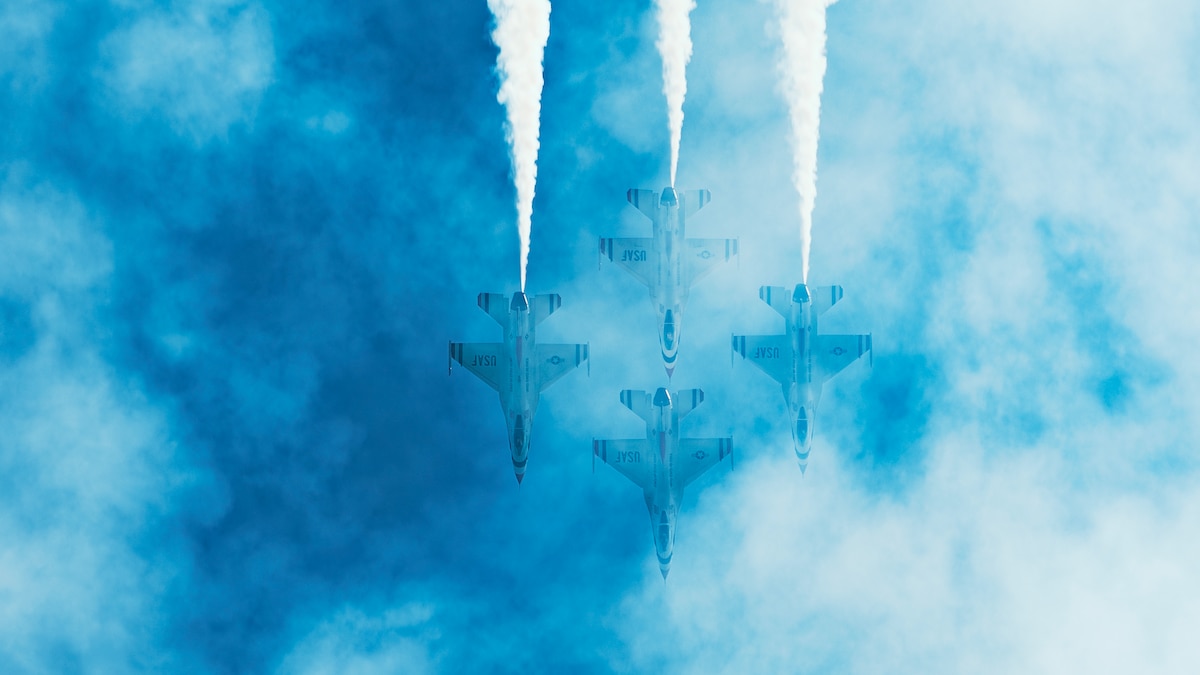 The United States Air Force Air Demonstration Squadron "Thunderbirds" F-16 Fighting Falcons fly over the Gulf of Mexico