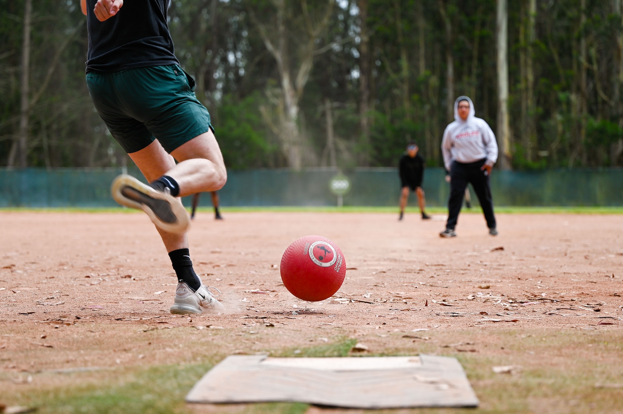 security forces members playing kickball