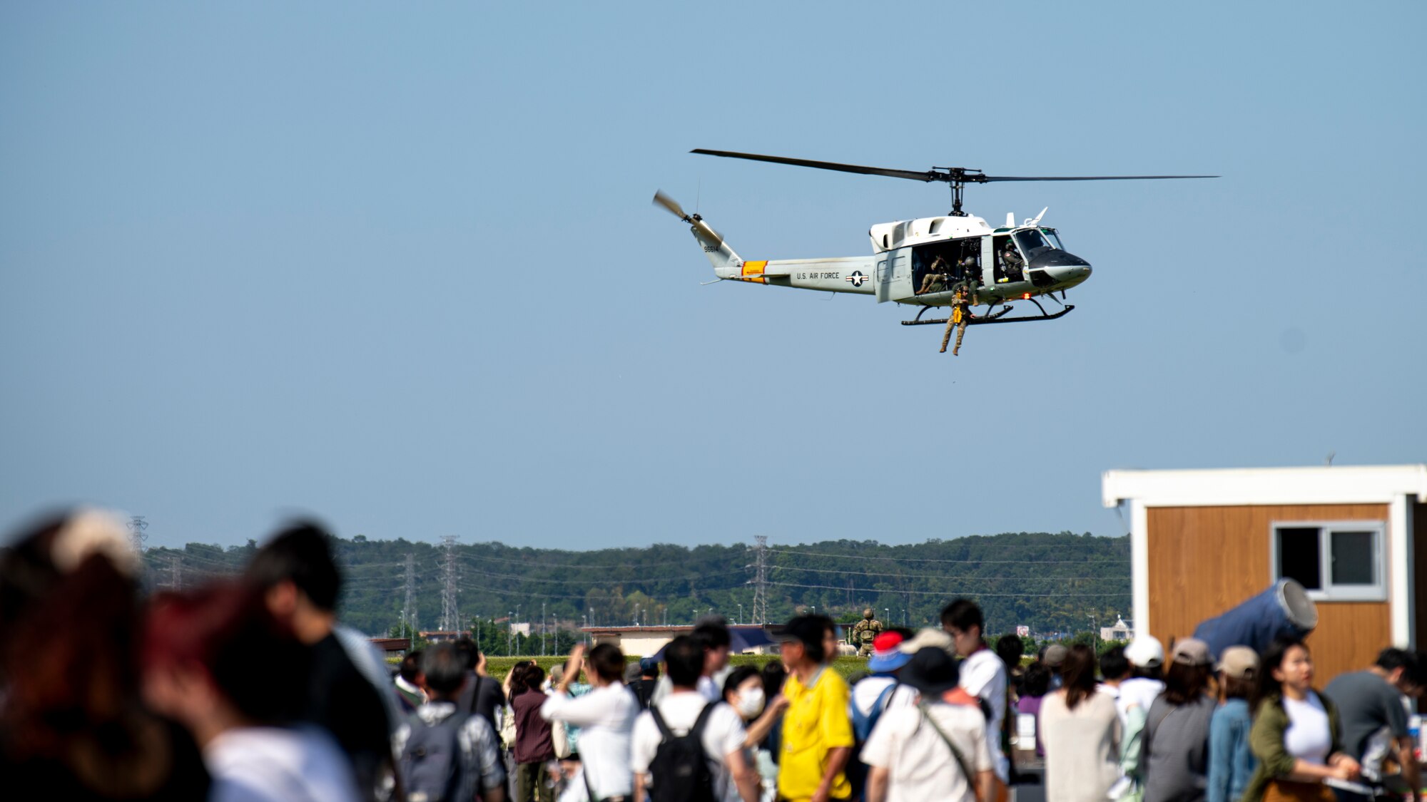 A U.S. Air Force UH-1N Huey assigned to the 459th Airlift Squadron executes a rescue demonstration at the 2024 Japanese-American Friendship Festival at Yokota Air Base.