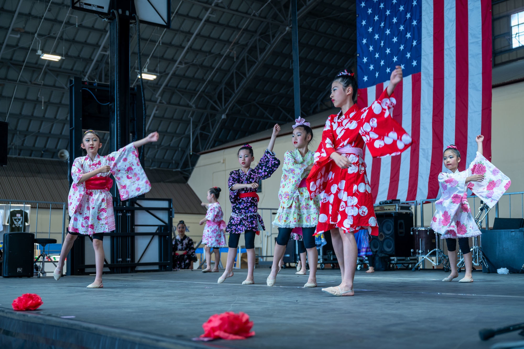 Performance group Angels showcase a kids dance on the indoor stage during the 2024 Japanese-American Friendship Festival at Yokota Air Base.