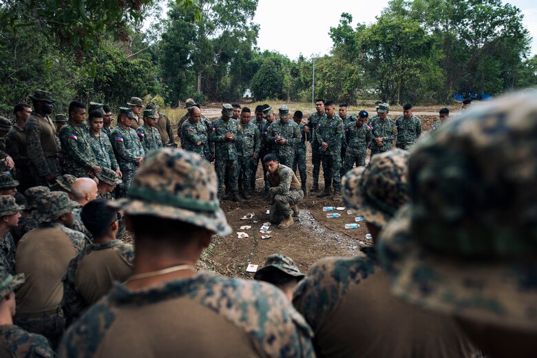 U.S. Marine Corps 1st Lt. Robert Lebron, center, the landing support platoon commander assigned to Combat Logistics Battalion 15, 15th Marine Expeditionary Unit, speaks about the scheme of maneuver for U.S. and Philippine Marines during a rehearsal of concept brief for a combined convoy and mobile defense exercise as part of Archipelagic Coastal Defense Continuum at Marine Base Camp Rodolfo, Puerto Princesa, Philippines, May 14, 2024. ACDC is a series of bilateral exchanges and training opportunities between U.S. Marines and Philippine Marines aimed at bolstering the Philippine Marine Corps’ Coastal Defense strategy while supporting modernization efforts of the Armed Forces of the Philippines.
