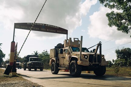 A U.S. Marine Corps Joint Light Tactical Vehicle departs Philippine Marine Base Camp Rodolfo with Philippine Marine Corps vehicles belonging to the 3rd Marine Brigade during a combined convoy and mobile defense exercise as part of Archipelagic Coastal Defense Continuum in Puerto Princesa, Palawan, Philippines, May 15, 2024.