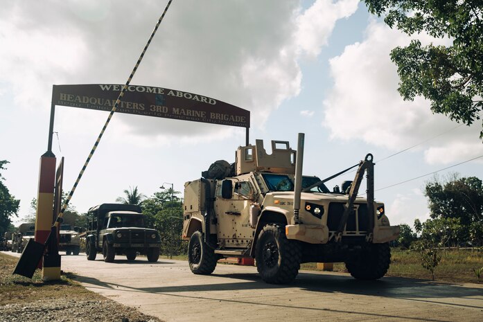 A U.S. Marine Corps Joint Light Tactical Vehicle departs Philippine Marine Base Camp Rodolfo with Philippine Marine Corps vehicles belonging to the 3rd Marine Brigade during a combined convoy and mobile defense exercise as part of Archipelagic Coastal Defense Continuum in Puerto Princesa, Palawan, Philippines, May 15, 2024.