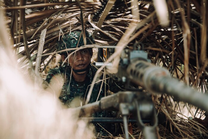 A Philippine Marine assigned to the 3rd Marine Brigade holds security with a .50-caliber machine gun at an integrated coastal defense site on Kamuning Beach, Palawan, Philippines, during Archipelagic Coastal Defense Continuum May 16, 2024. ACDC is a series of bilateral exchanges and training opportunities between U.S. Marines and Philippine Marines aimed at bolstering the Philippine Marine Corps' Coastal Defense strategy while supporting the modernization efforts of the Armed Forces of the Philippines.
