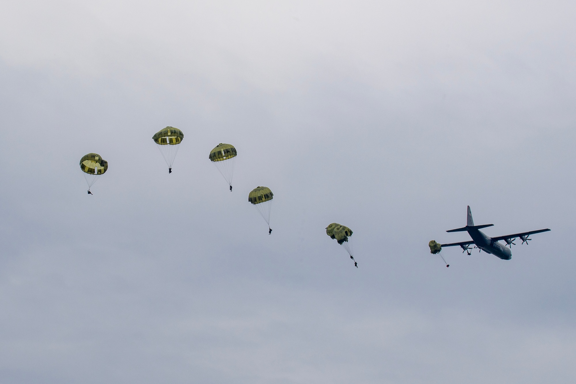 Japan Ground Self-Defense Force paratroopers with the 1st Airborne Brigade conduct a static-line jump from a U.S. Air Force C-130J Super Hercules assigned to the 36th Airlift Squadron during the Japanese-American Friendship Festival 2024 at Yokota Air Base.