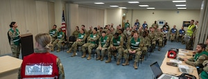 U.S. Airmen with the 100th Air Refueling Wing attend a simulated personnel support for contingency operations reception briefing during the base readiness exercise Aw-R-Go at Royal Air Force Mildenhall, England, May 10, 2024.