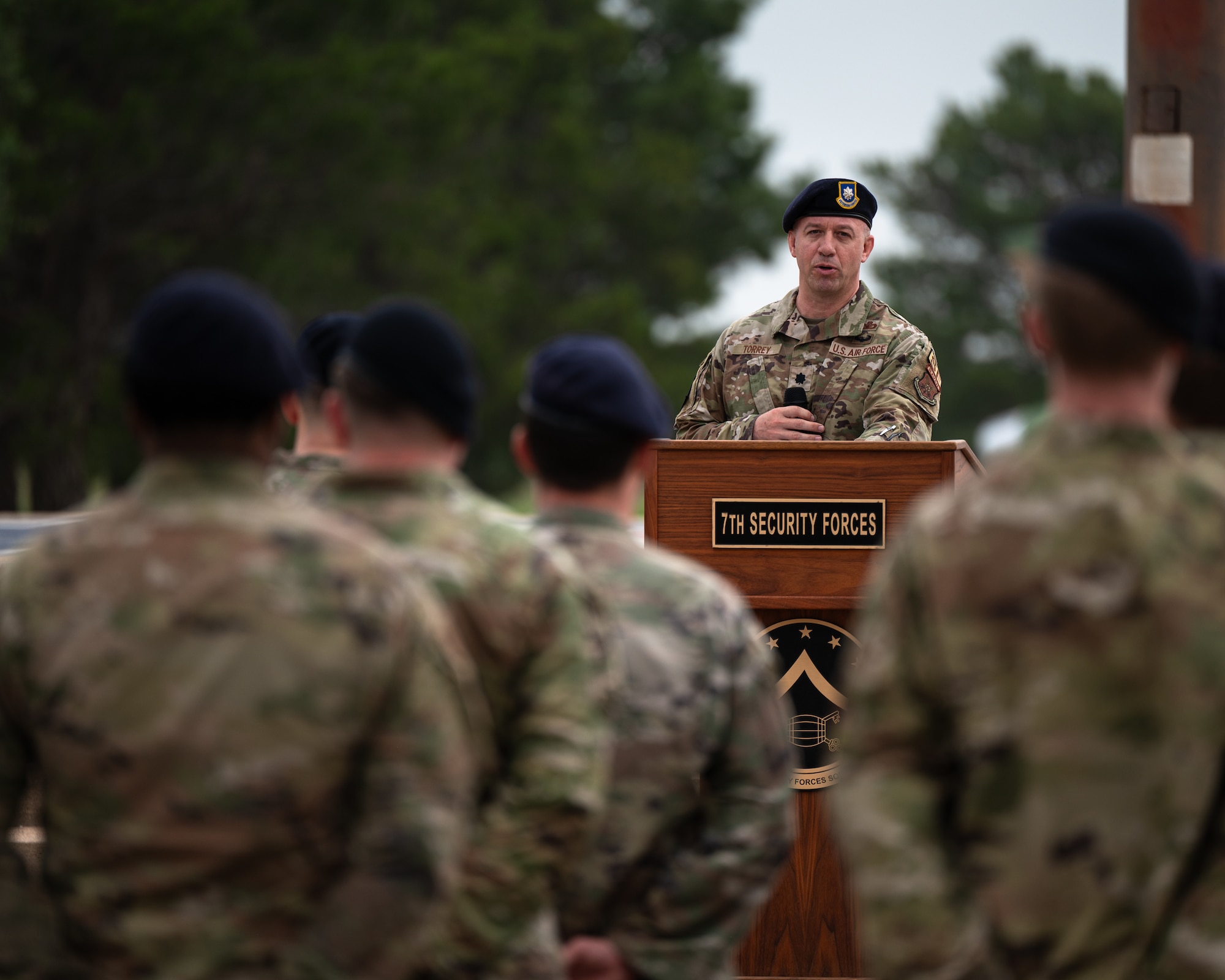 U.S. Air Force Lt. Col. Erland Torrey, 7th Security Forces Squadron commander, speaks during the opening ceremony for National Police Week at Dyess Air Force Base, Texas, May 13, 2024. Torrey spoke on the topic of National Military Police Week, offering his insight as a field training sergeant for the Las Vegas Metropolitan Police Department where he has worked for the last 17 years. (U.S. Air Force photo by Airman 1st Class Jade M. Caldwell)