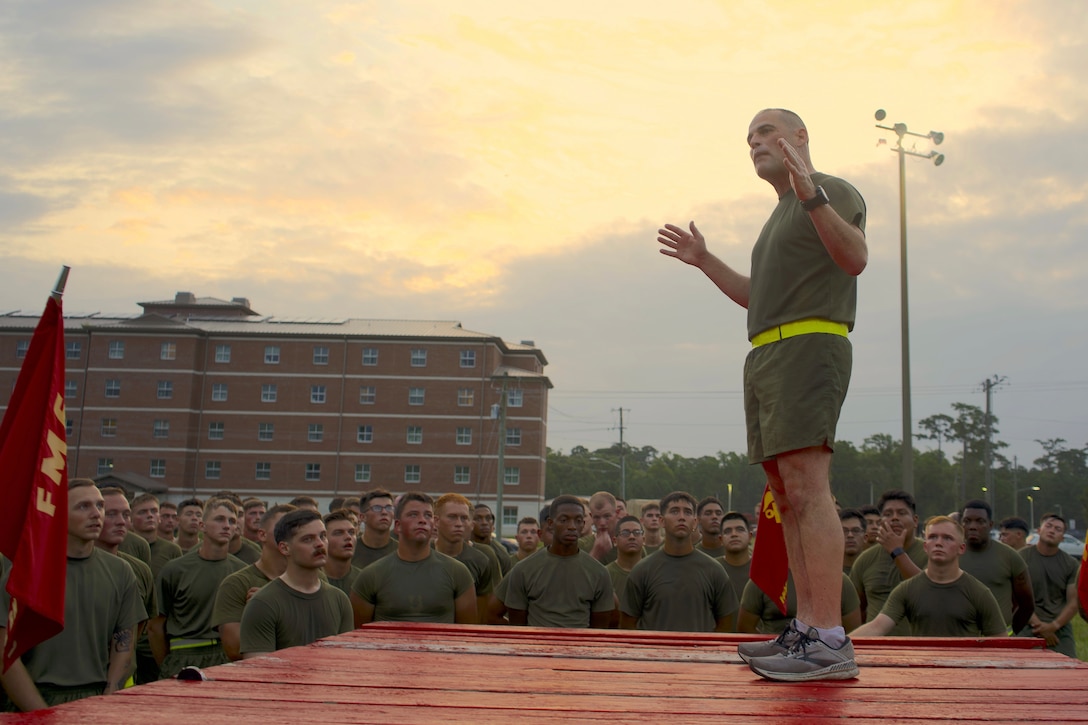 U.S. Marine Corps Col. Damon Burrows, Commanding Officer, Headquarters Battalion, 2d Marine Division speaks amongst Marines on Camp Lejeune, North Carolina, August 4, 2023. The Motivational run serves to boost camaraderie and unit cohesion while promoting physical fitness. (U.S. Marine Corps photo by LCpl Max Arellano)
