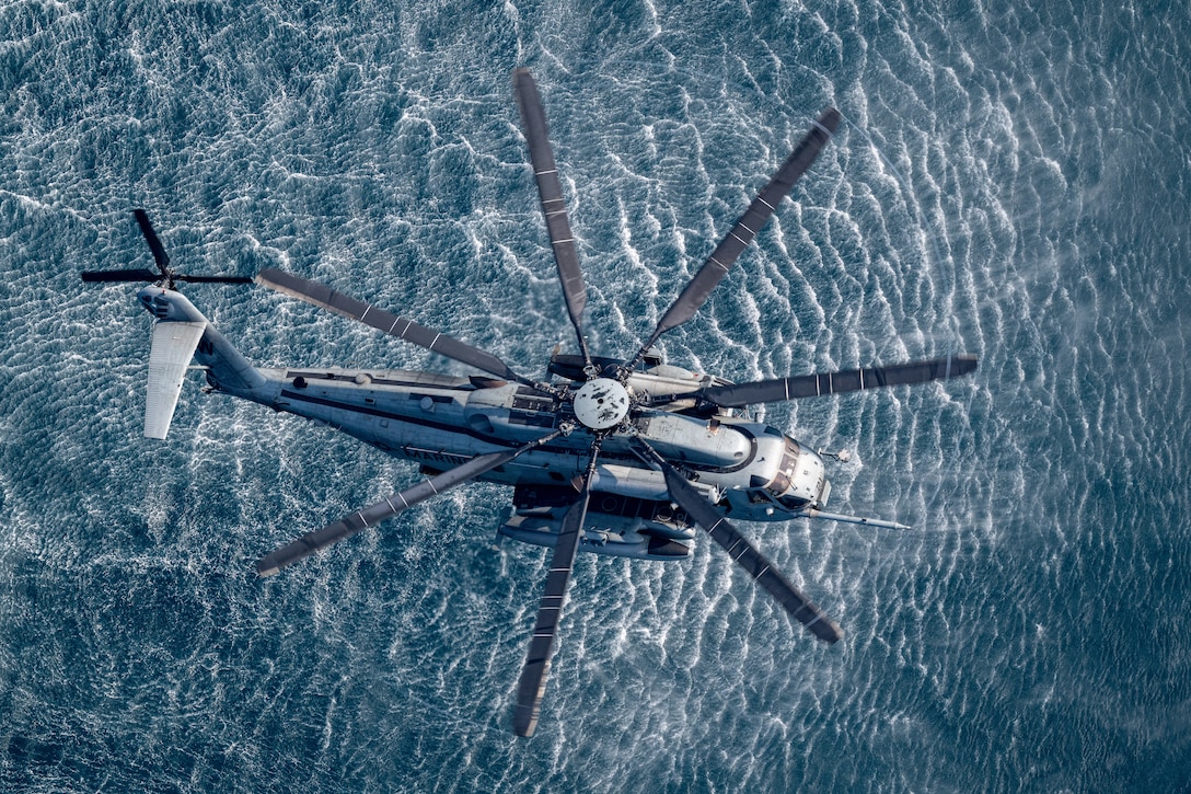 A CH-53E Super Stallion, assigned to the “White Knights” of Marine Medium Tiltrotor Squadron 165, hovers in formation above the Indian Ocean during Cooperation Afloat Readiness and Training (CARAT) Indonesia 2024, May 19, 2024. This year’s exercise coincides with 75 years of diplomatic relations between the United States and Indonesia. In its 30th year, the CARAT series is comprised of multinational exercises, designed to enhance U.S. and partner navies’ abilities to operate together in response to traditional and non-traditional maritime security challenges in the Indo-Pacific region.