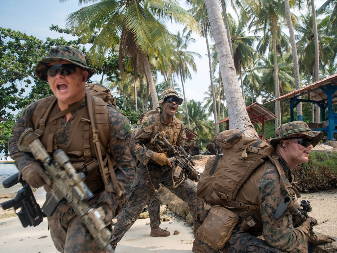 U.S. Marines assigned to Light Armored Reconnaissance Company, Battalion Landing Team 1/5, 15th Marine Expeditionary Unit, move to contact after assaulting a beach during an amphibious assault exercise during Exercise Cooperation Afloat Readiness and Training (CARAT) Indonesia 24 Bandar Lampung, Indonesia, May 18, 2024. CARAT Indonesia 2024 is a bilateral exercise that is designed to promote regional security cooperation and enhance maritime interoperability, which coincides with 75 years of diplomatic relations between the U.S. and Indonesia. In its 30th year, the CARAT series is comprised of multinational exercises that enhance U.S. and partner navies' abilities to operate together in response to maritime security challenges in the Indo-Pacific region. (U.S. Marine Corps photo by Sgt. Patrick Katz)