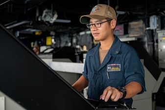 Lt. j.g. Phong Huynh monitors surface contacts aboard USS Somerset (LPD 25) during CARAT Indonesia in the Indian Ocean.
