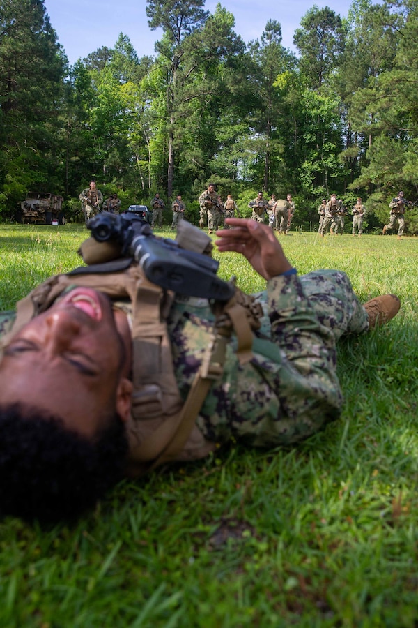 A U.S. Naval Academy Midshipmen, acts as simulated causality, during a Career Orientation Training for Midshipmen (CORTRAMID) on Camp Lejeune, North Carolina, May 17, 2024. The CORTRAMID program is a basic introduction and training event to familiarize U.S. Naval Academy Midshipmen with the primary warfare designators that they will serve in, along with providing them with exposure to what is often their first Marine Corps fleet experience. (U.S. Marine Corps photos by Lance Cpl. Christian Salazar)