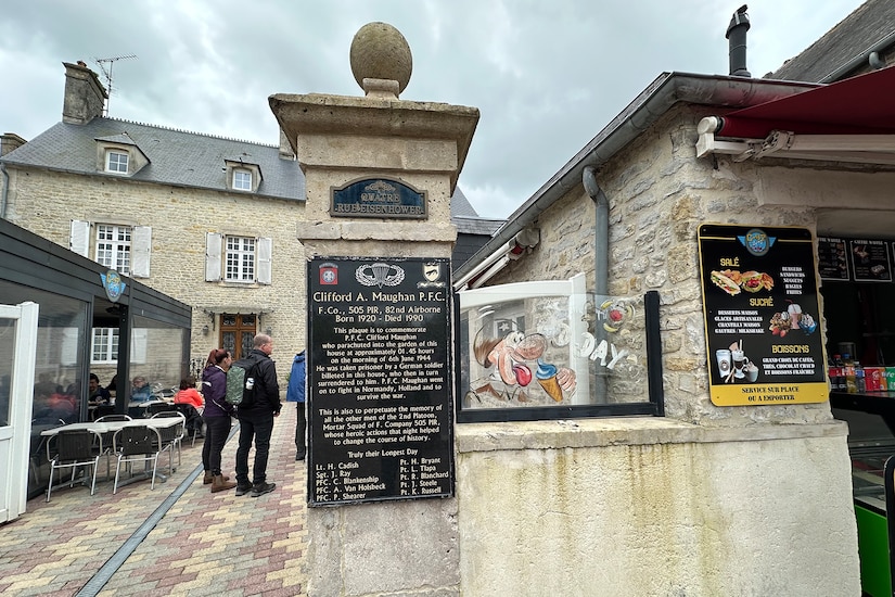 A plaque commemorates Army Pfc. Clifford A. Maughan and others who landed on D-Day.