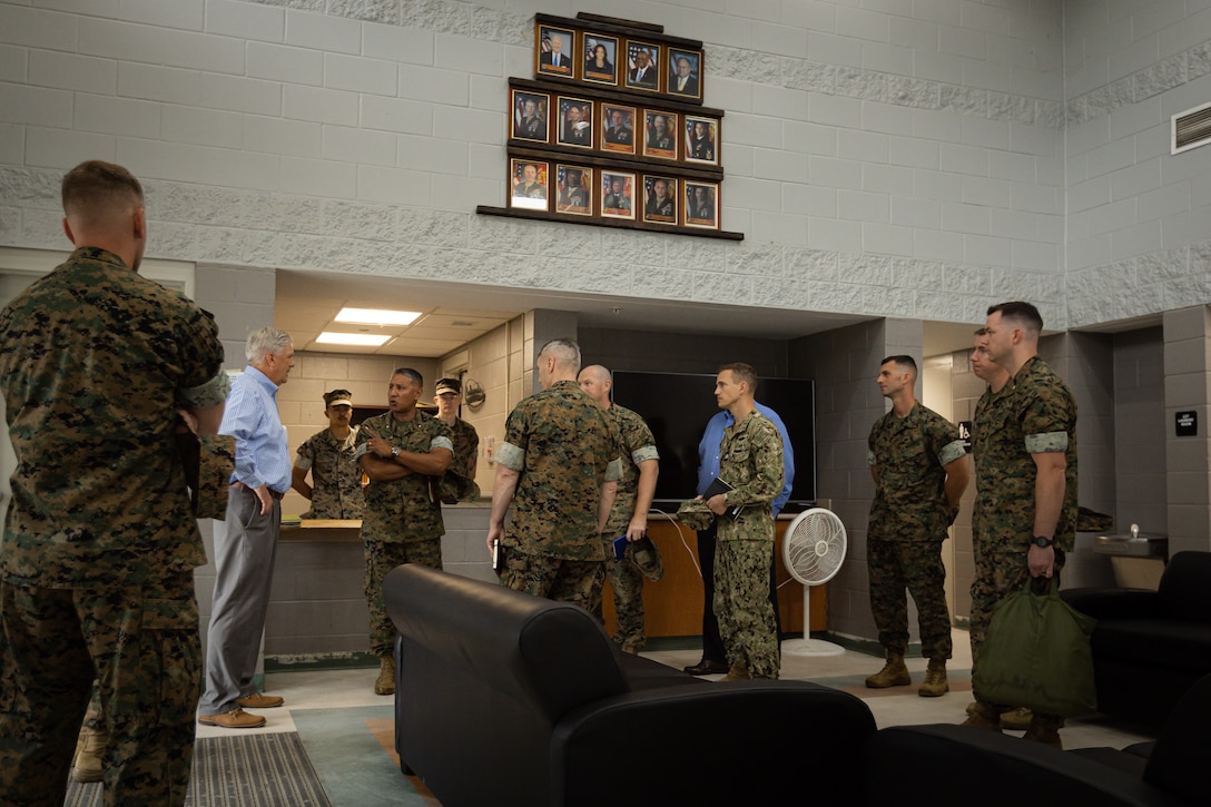 U.S. Marine Corps Brig. Gen. Adolfo Garcia Jr., center left, commanding general, Marine Corps Installations East-Marine Corps Base (MCB) Camp Lejeune, tours barracks building FC504 alongside Gen. Christopher J. Mahoney, center, the assistant commandant of the Marine Corps (ACMC), and 2nd Marine Logistics Group (MLG) leaders, during a visit to MCB Camp Lejeune, North Carolina, May 14, 2024. The ACMC visited MCB Camp Lejeune to view current barracks living conditions and observe 2nd MLG and II Marine Expeditionary Force’s capabilities. (U.S. Marine Corps photo by Cpl. Antonino Mazzamuto)