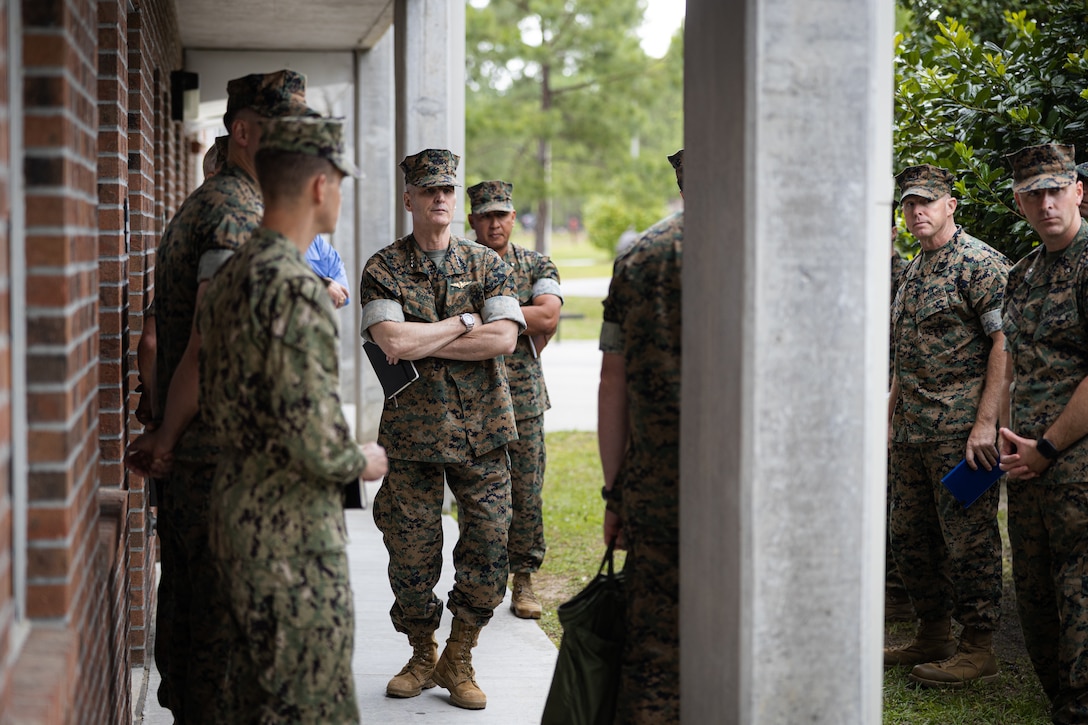 U.S. Marine Corps Gen. Christopher J. Mahoney, the assistant commandant of the Marine Corps (ACMC), speaks to Marine Corps Installations East-Marine Corps Base (MCB) Camp Lejeune and 2nd Marine Logistics Group (MLG) leaders outside of barracks building FC504 during a visit to MCB Camp Lejeune, North Carolina, May 14, 2024. The ACMC visited MCB Camp Lejeune to view current barracks living conditions and observe 2nd MLG and II Marine Expeditionary Force’s capabilities. (U.S. Marine Corps photo by Cpl. Antonino Mazzamuto)