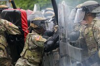 U.S. Army Soldiers with the 372nd Military Police Battalion, District of Columbia Army National Guard participate in a joint training event with the 113th Security Forces Squadron at Fort Belvoir, Va. May 19, 2024. The training engages members of the D.C. National Guard to improve interoperability and familiarity to ensure personnel are ready to support civilian lead agency partners involved in high-profile events across the DMV.