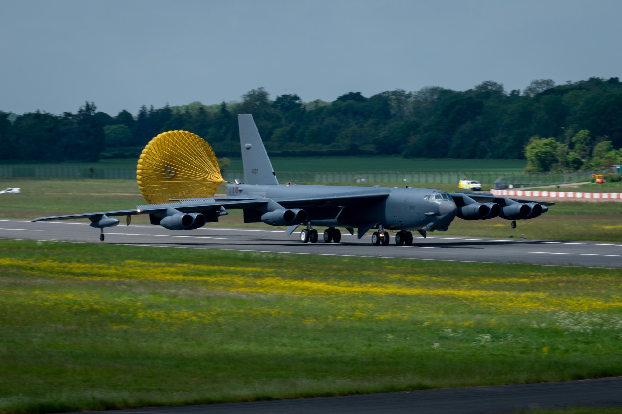 Bomber aircraft lands on runway.