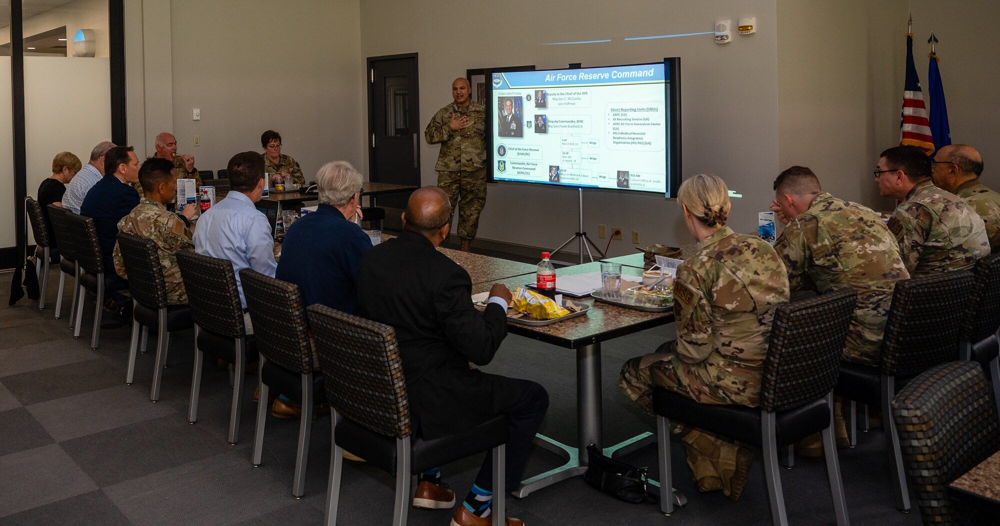 Col. Jeffrey Smith, the 932nd AW commander, engages honorary commanders during lunch at the Nightingale Dining Facility, Scott AFB, Illinois, May 5, during honorary commander immersion day.  Smith discussed a wide range of issues and topics facing both the Wing and the Air Force Reserve. He also explained some of the challenges faced by 932nd AW members and fielded questions from the honorary commanders.