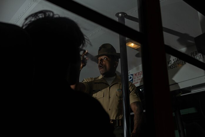 U.S. Marine Corps Staff Sgt. David Thomas, a drill instructor with Receiving Company, Support Battalion, provides instructions to the new recruits of Mike Company, 3rd Recruit Training Battalion as part of the receiving process at Marine Corps Recruit Depot San Diego, California, May 13, 2024. During the receiving process, recruits are searched for contraband, given a haircut, allowed a phone call home, and issued gear. (U.S. Marine Corps photo by Cpl. Sarah M. Grawcock)