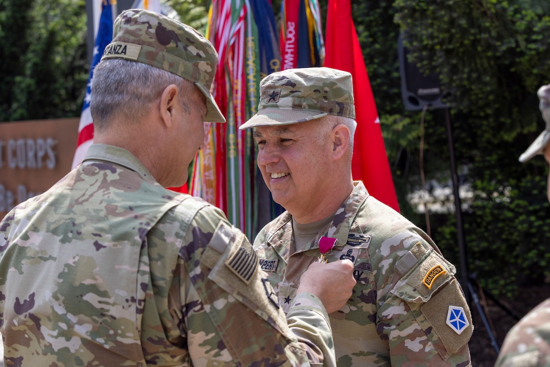 U.S. Army Lt. Gen. Charles Costanza, the commanding general of V Corps, pins the Legion of Merit onto Brig. Gen. Kevin Lambert, the outgoing deputy commanding general of support for V Corps, at Poznan, Poland, May 16, 2024. The Legion of Merit is a military award of the United States Armed Forces that is given for exceptionally meritorious conduct in the performance of outstanding services and achievements. (U.S. Army photo by Staff Sgt. Jameson Harris)