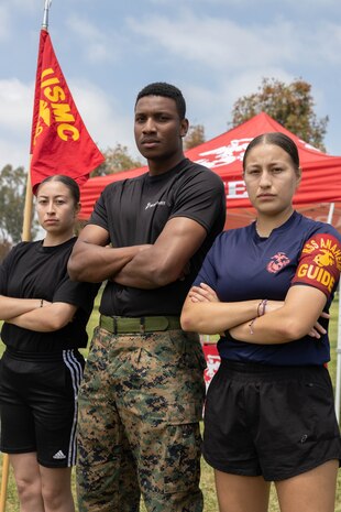 U.S. Marine Corps Staff Sgt. Demetrius Patterson, center, a canvassing recruiter with Recruiting Sub-Station Anaheim, Recruiting Station Orange County, poses for a photograph with poolee Paola Anaya, right, and a guest during a pool function in Fountain Valley, Calif., May 11, 2024. Pool functions are held to prepare poolees for the mental and physical rigors of recruit training. (U.S. Marine Corps photo by Cpl. Fred Garcia)