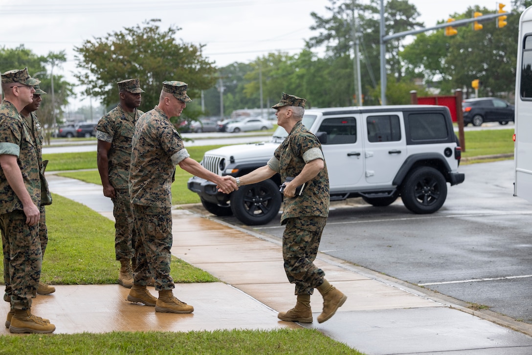 U.S. Marine Corps  Brig. Gen. Michael E. McWilliams, commanding general, 2nd Marine Logistics Group, left, welcomes General Christopher J. Mahoney, Assistant Commandant of the Marine Corps, during his visit to the 2nd MLG Human Performance Center on Camp Lejeune, North Carolina, May 14, 2024. Gen. Mahoney visited various facilities and infrastructures of 2nd MLG while visiting Camp Lejeune. (U.S. Marine Corps photo by Lance Cpl. Jessica J. Mazzamuto)
