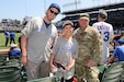 Baseball fans joined U.S. Army Reserve Master Sgt. Robert Maresh, right, G-3 mobilization cell, 85th U.S. Army Reserve Support Command, at Wrigley Field before the start of the Chicago Cubs versus Pittsburg Pirates game, May 17, 2024.