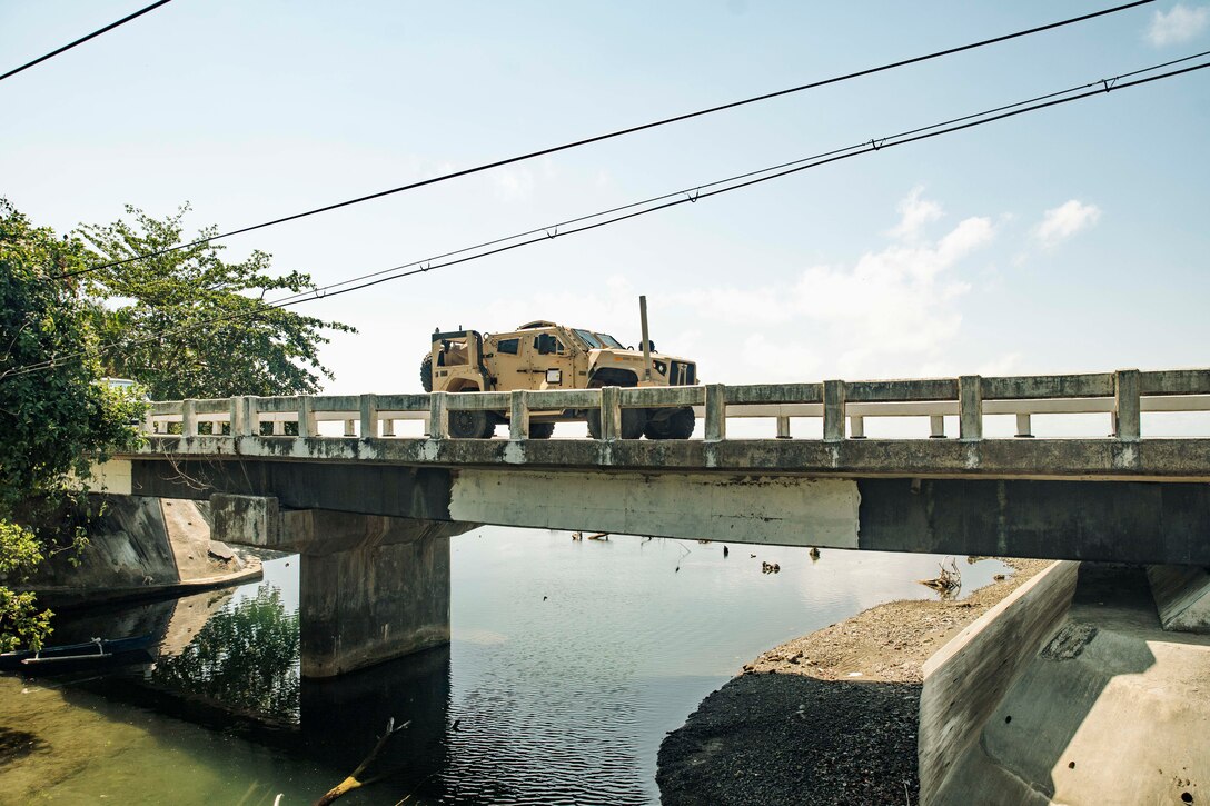 A U.S. Marine Corps Joint Light Tactical Vehicle attached to the 15th Marine Expeditionary Unit drives over a bridge during a combined convoy and mobile defense exercise with Philippine Marines assigned to the 3rd Marine Brigade as part of Archipelagic Coastal Defense Continuum in Palawan, Philippines, May 15, 2024. ACDC is a series of bilateral exchanges and training opportunities between U.S. Marines and Philippine Marines aimed at bolstering the Philippine Marine Corps' Coastal Defense strategy while supporting the modernization efforts of the Armed Forces of the Philippines. (U.S. Marine Corps photo by Cpl. Joseph Helms)