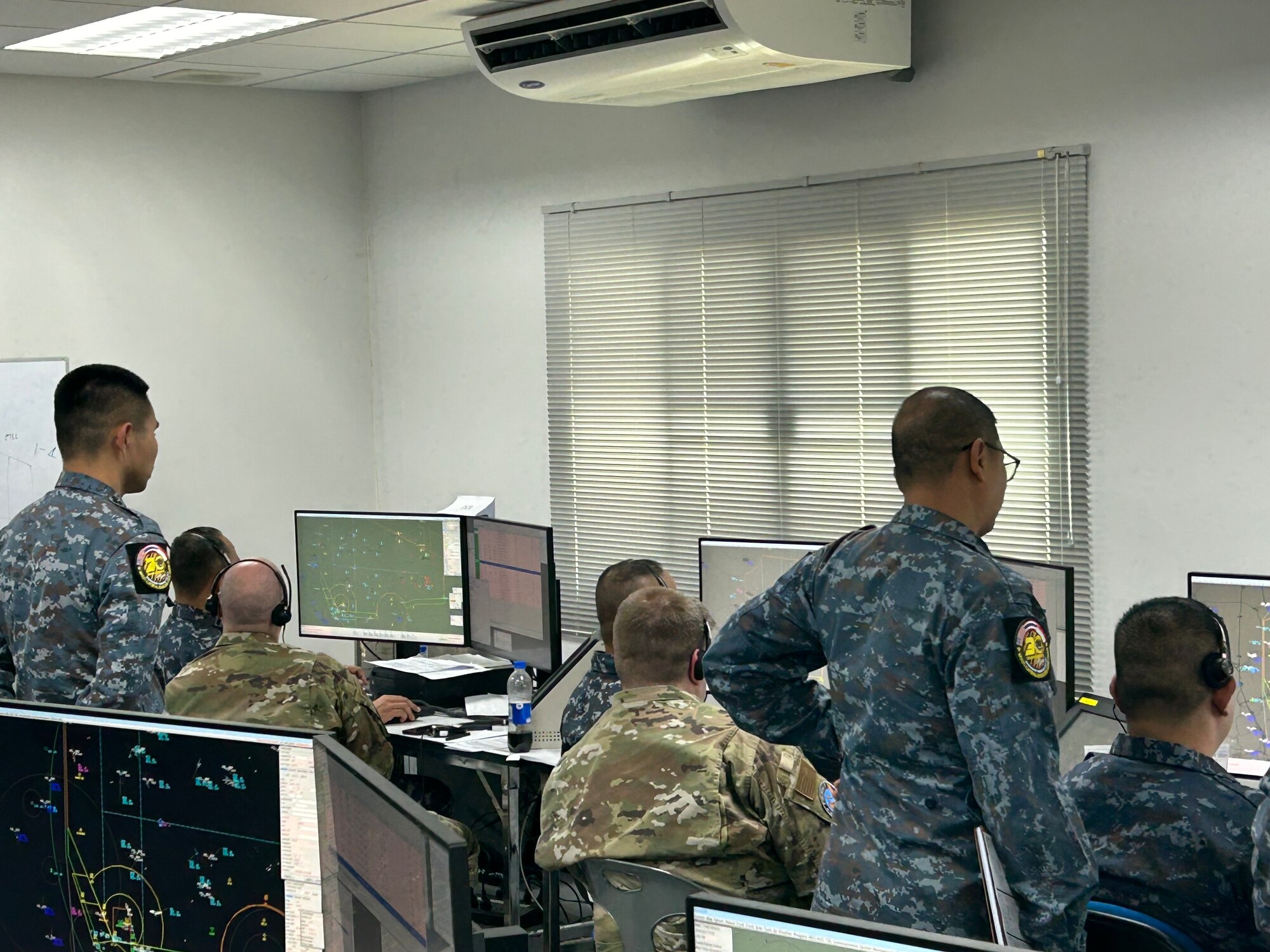 Airmen working on a computer