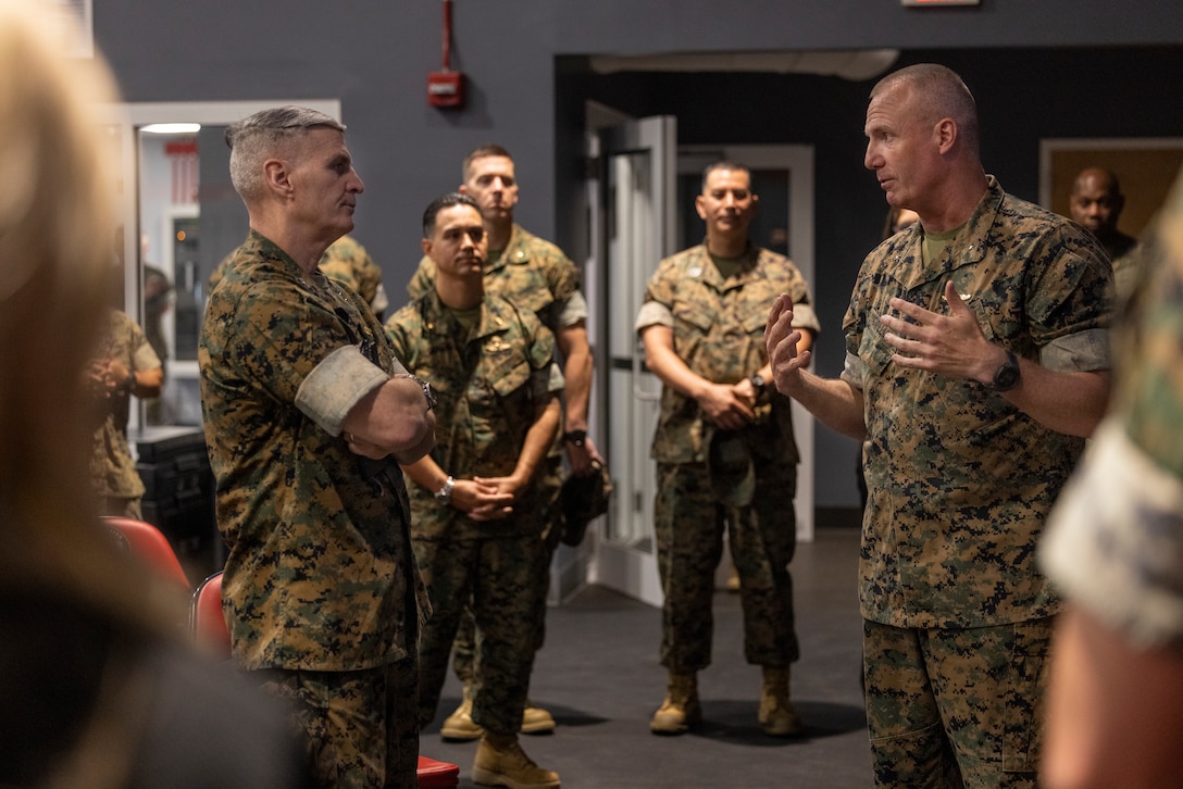 U.S. Marine Corps Brig. Gen. Michael E. McWilliams, commanding general, 2nd Marine Logistics Group, right, explains the history of the 2nd MLG Human Performance Center to General Christopher J. Mahoney, Assistant Commandant of the Marine Corps, during his visit to the 2nd MLG HPC on Camp Lejeune, North Carolina, May 14, 2024. Gen. Mahoney visited various facilities and infrastructures of 2nd MLG while visiting Camp Lejeune. (U.S. Marine Corps photo by Lance Cpl. Jessica J. Mazzamuto)