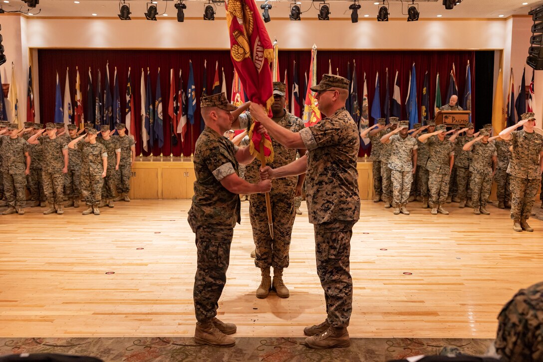 U.S. Marine Corps Col. Chris Niedziocha, the incoming commanding officer of 31st Marine Expeditionary Unit, left, receives the colors from Col. Matthew Danner, the outgoing commanding officer of 31st Marine Expeditionary Unit, during a change of command ceremony at Camp Hansen, Okinawa, Japan, May 20, 2024. The passing of the colors represents the transfer of responsibility, authority and accountability of the unit. The 31st MEU, the Marine Corps’ only continuously forward-deployed MEU, provides a flexible and lethal force ready to perform a wide range of military operations as the premiere crisis response force in the Indo-Pacific region. (U.S. Marine Corps photo by Lance Cpl. Osmar Gutierrez)