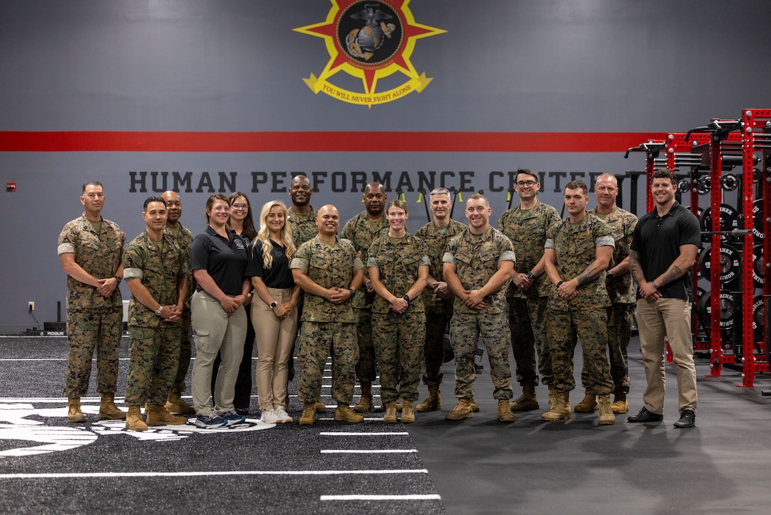 U.S. Marine Corps General Christopher J. Mahoney, Assistant Commandant of the Marine Corps, poses for a photo with 2nd MLG Human Performance Center staff on Camp Lejeune, North Carolina, May 14, 2024. Gen. Mahoney visited various facilities and infrastructures of 2nd MLG while visiting Camp Lejeune. (U.S. Marine Corps photo by Lance Cpl. Jessica J. Mazzamuto)