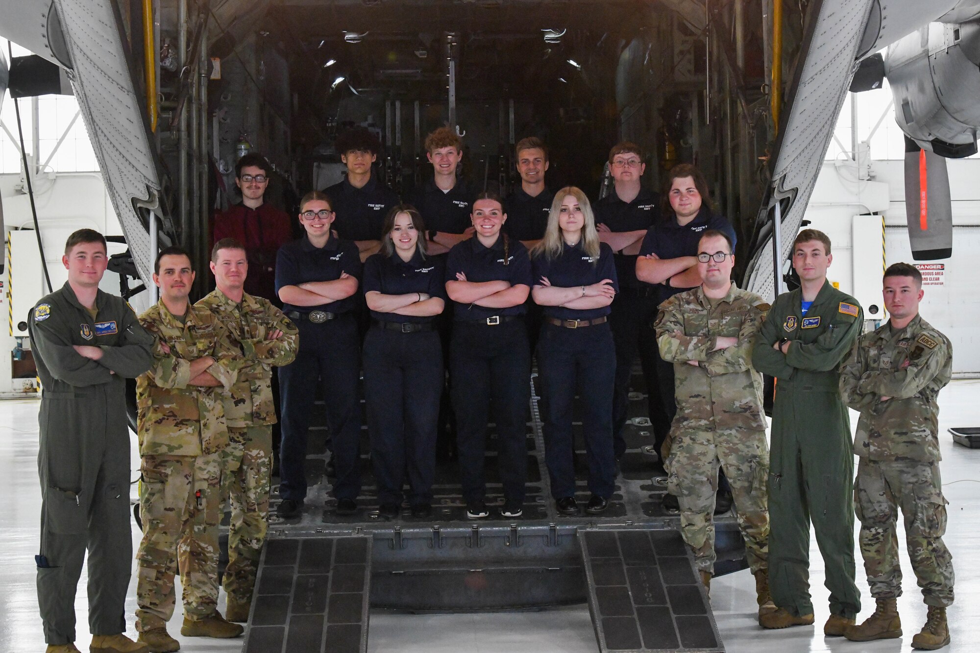 Reserve Citizen Airmen assigned to the 910th Airlift Wing and local high school students from Barberton High School pose for a group photo in front of a C-130H Hercules at Youngstown Air Reserve Station, Ohio, May 17, 2024.