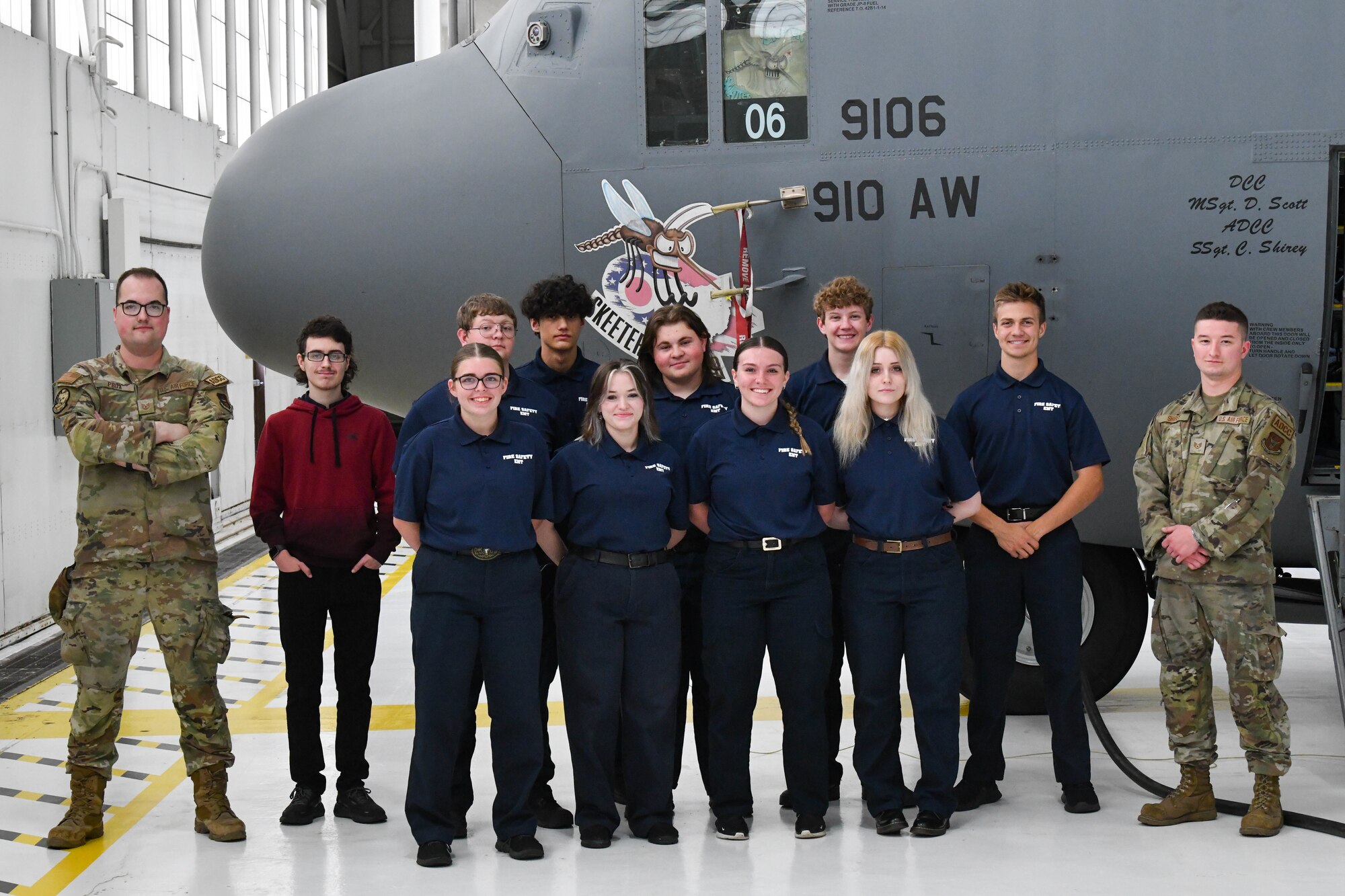 Reserve Citizen Airmen assigned to the 910th Airlift Wing and local high school students from Barberton High School pose for a group photo in front of a C-130H Hercules at Youngstown Air Reserve Station, Ohio, May 17, 2024.